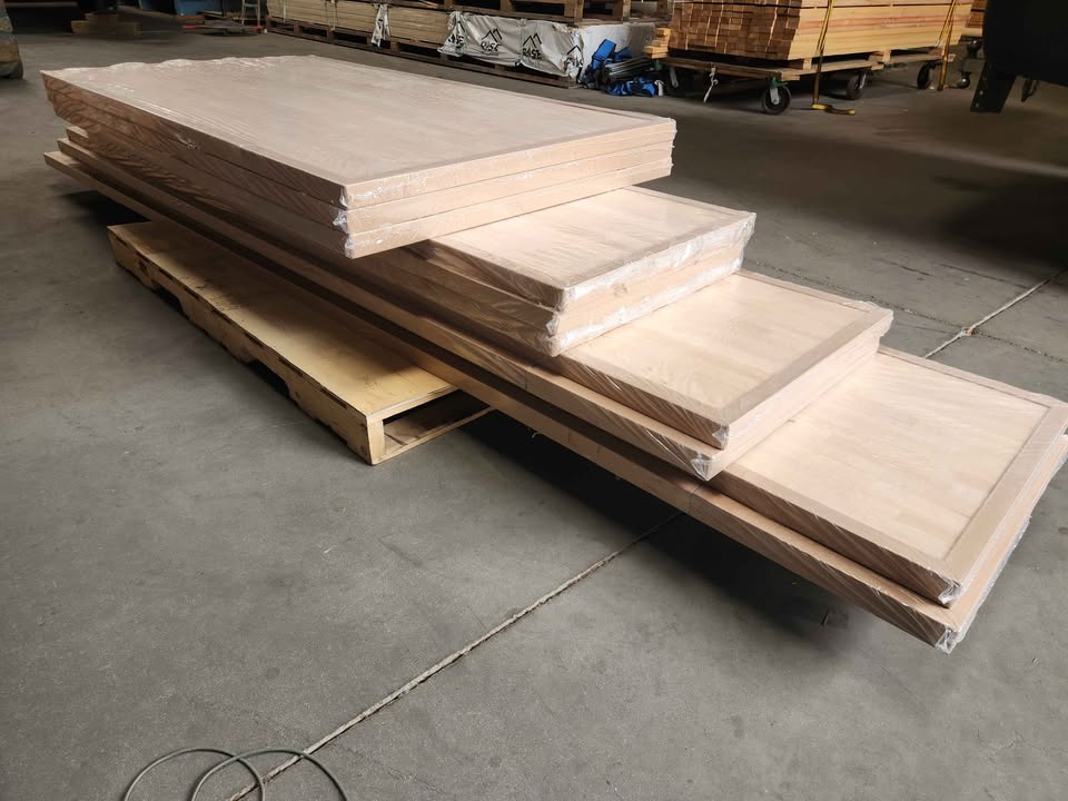 Unfinished Hevea butcher block countertops stacked on a pallet